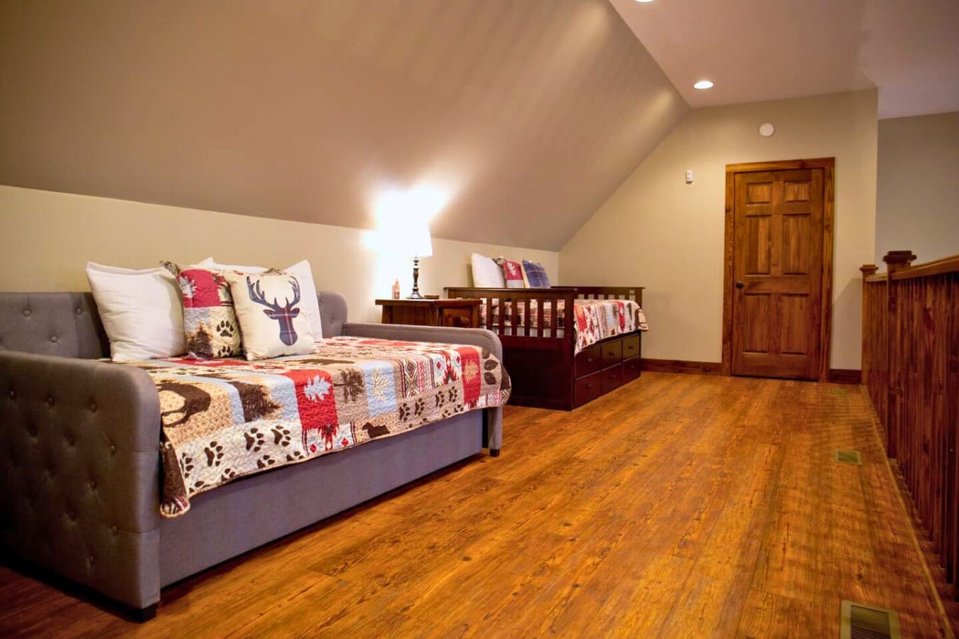 This loft features two trundle beds, each with a pull-out option, providing a total of four twin-sized beds for additional sleeping space.