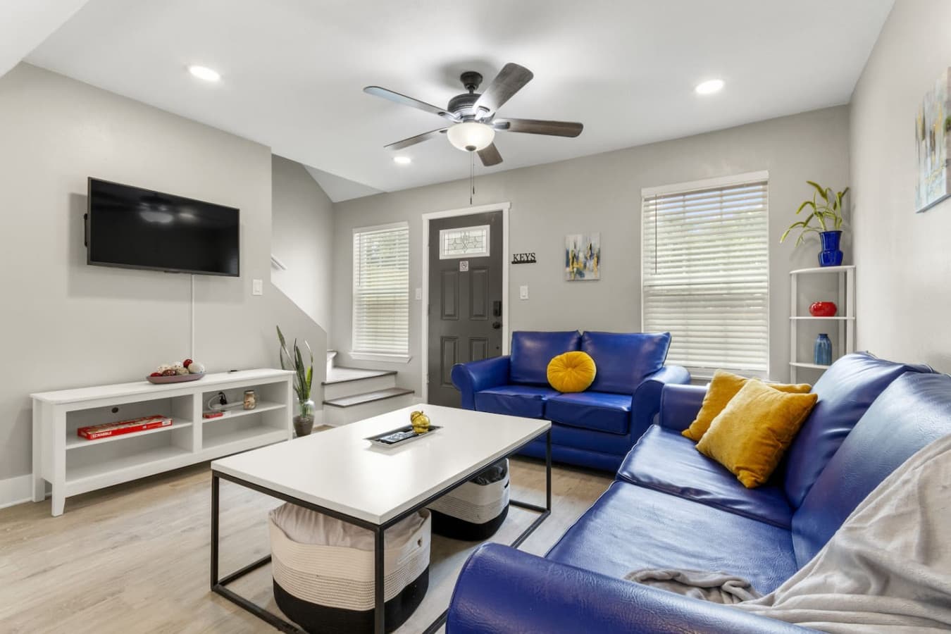 With plenty of seating, this bright and inviting living room is your ideal spot for a movie night or casual hangout.