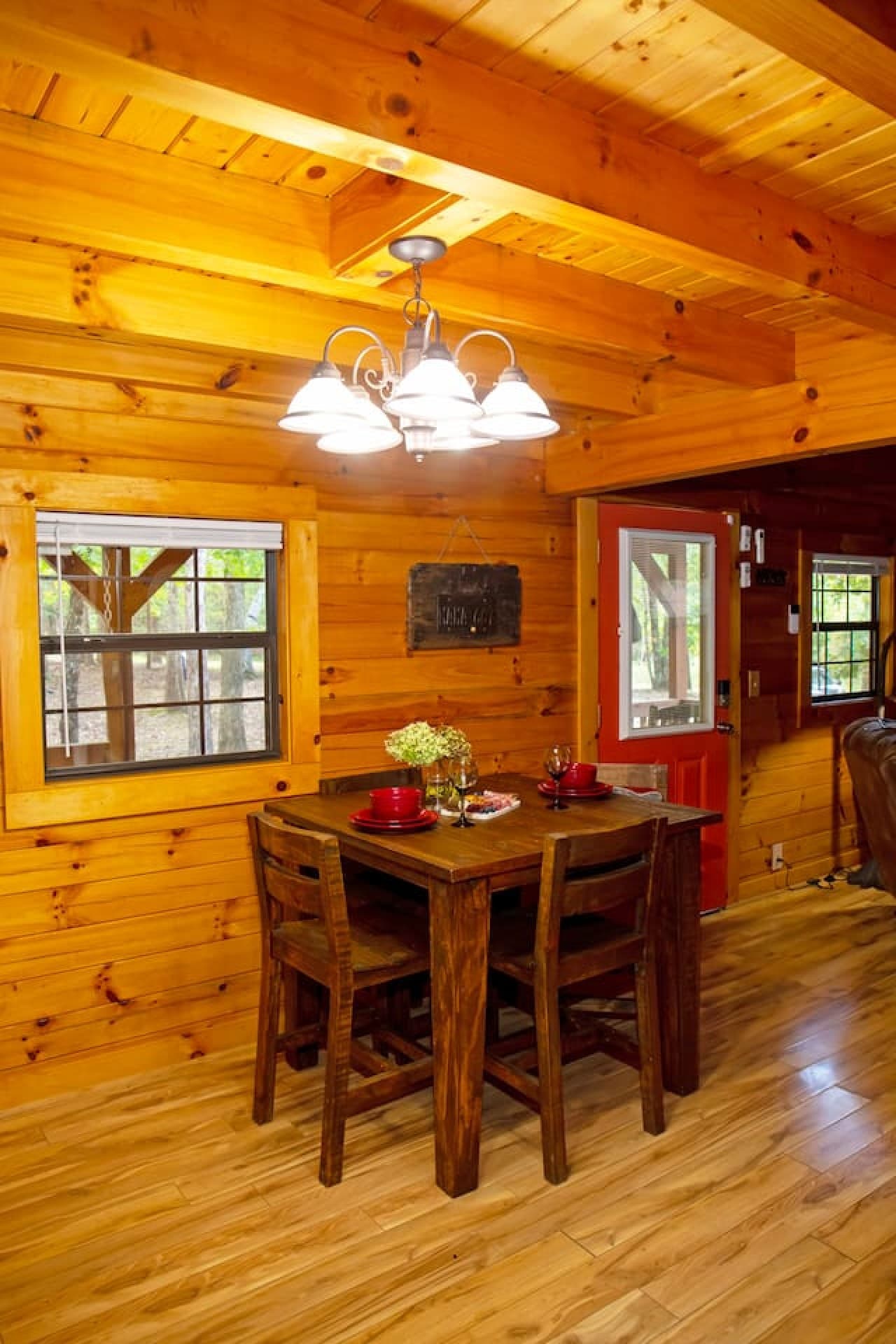 Dining table that seats 4, perfect for meals or laptop-friendly work.
