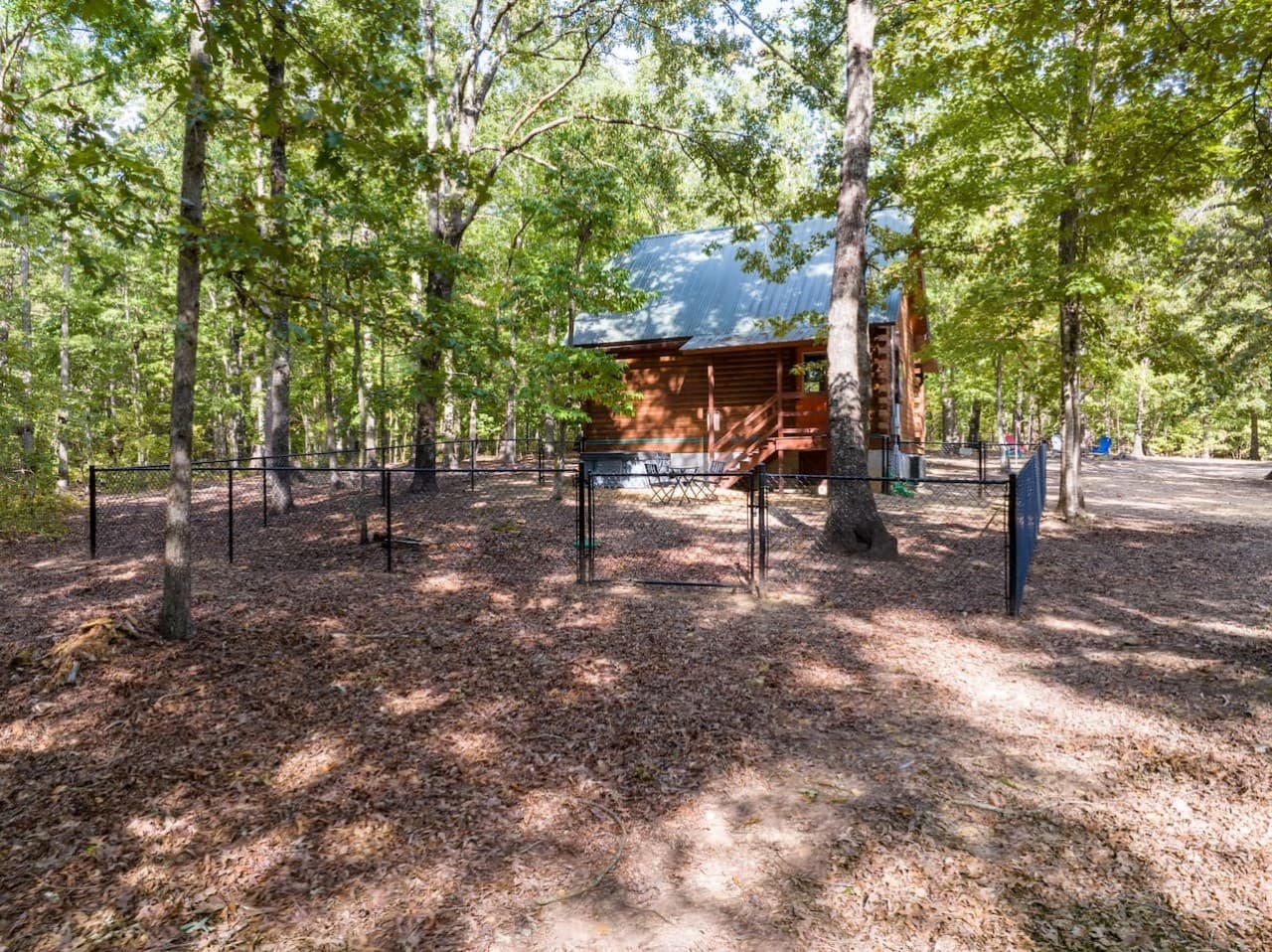Fenced in backyard of the Walden Cabin.