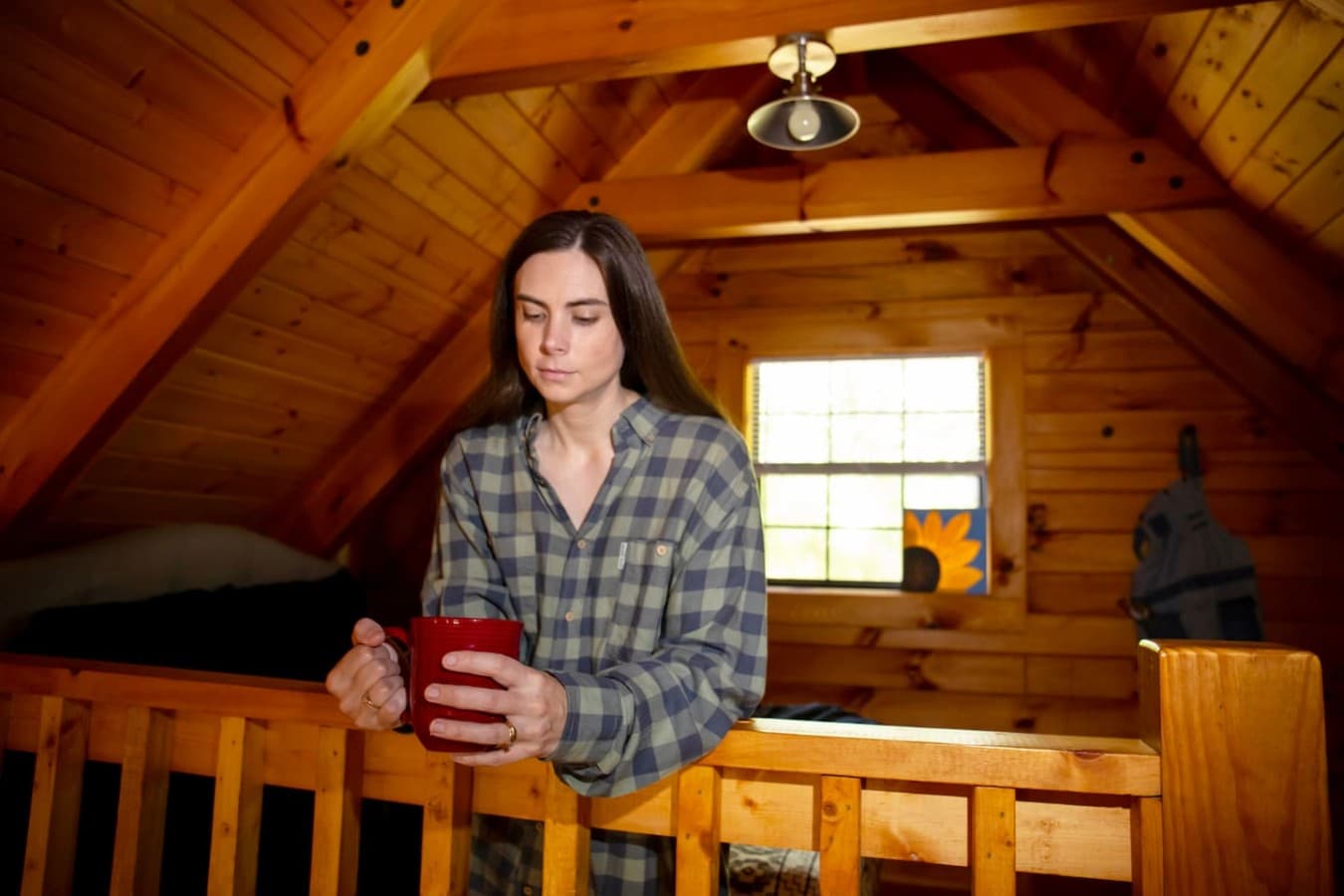The loft bedroom features a cozy queen-sized bed.