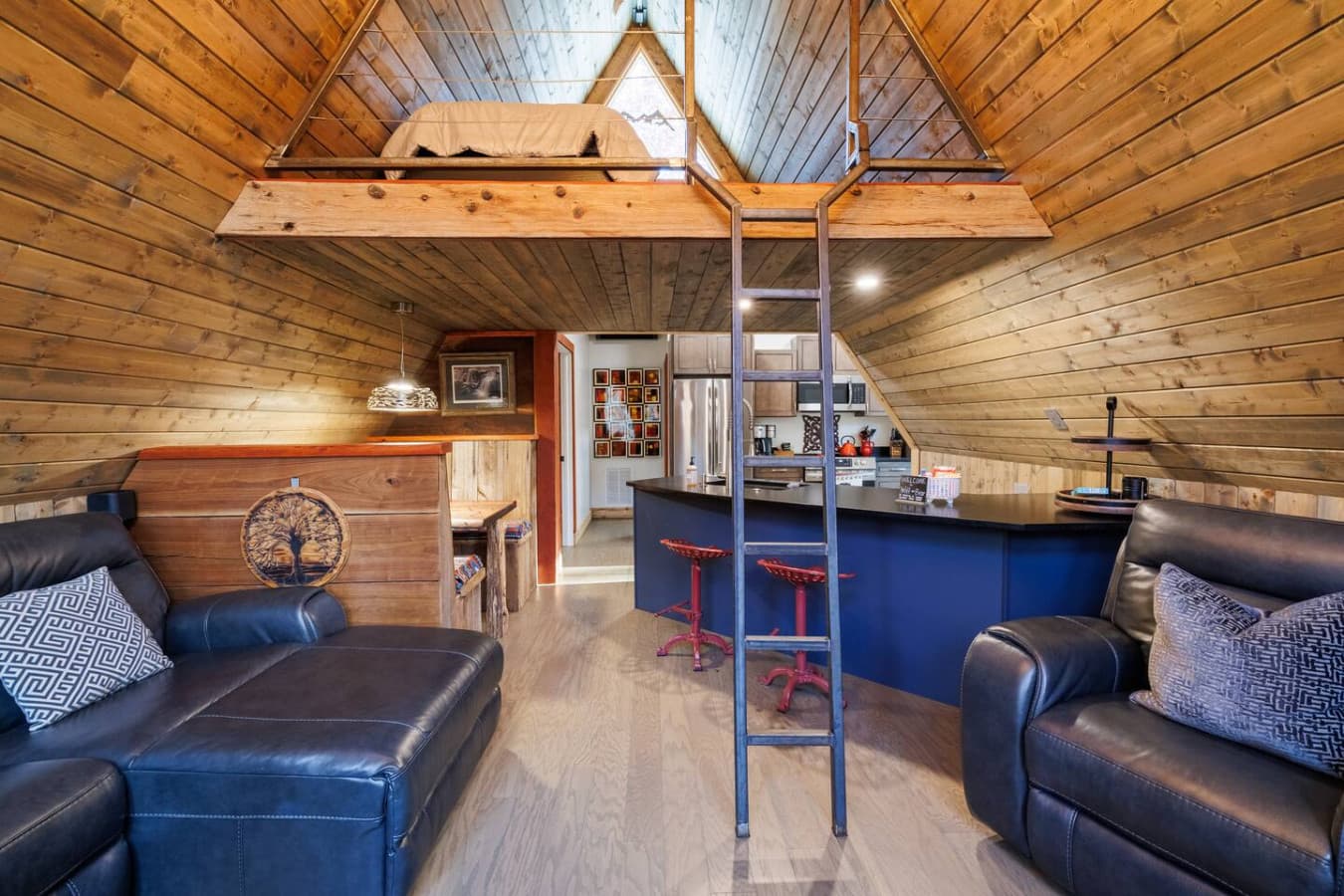 Open concept living, dining and kitchen areas. You can access the loft (Bedroom 2) directly from here.