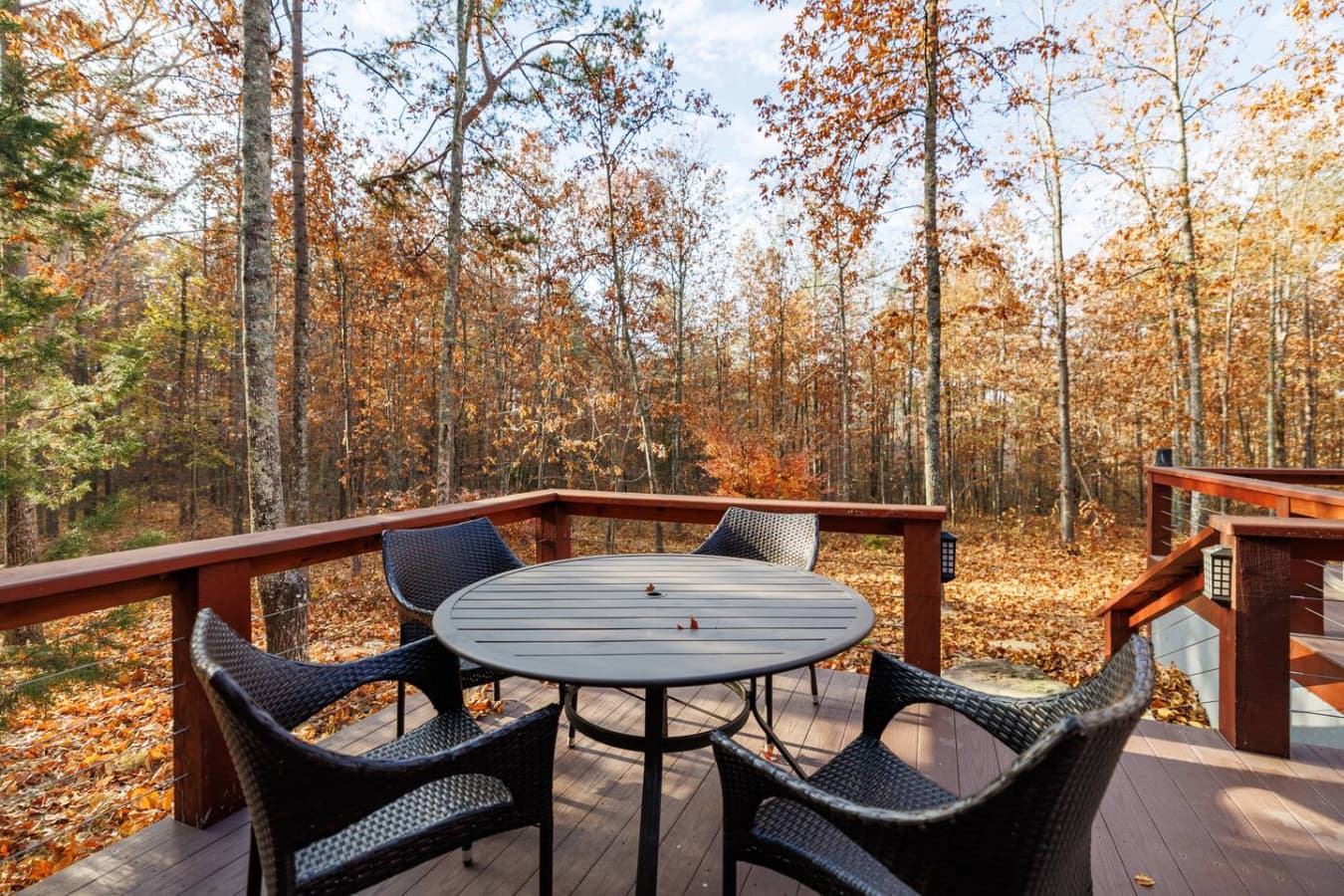 Relax in style with outdoor furniture on the wrap-around porch, perfect for enjoying the fresh air.