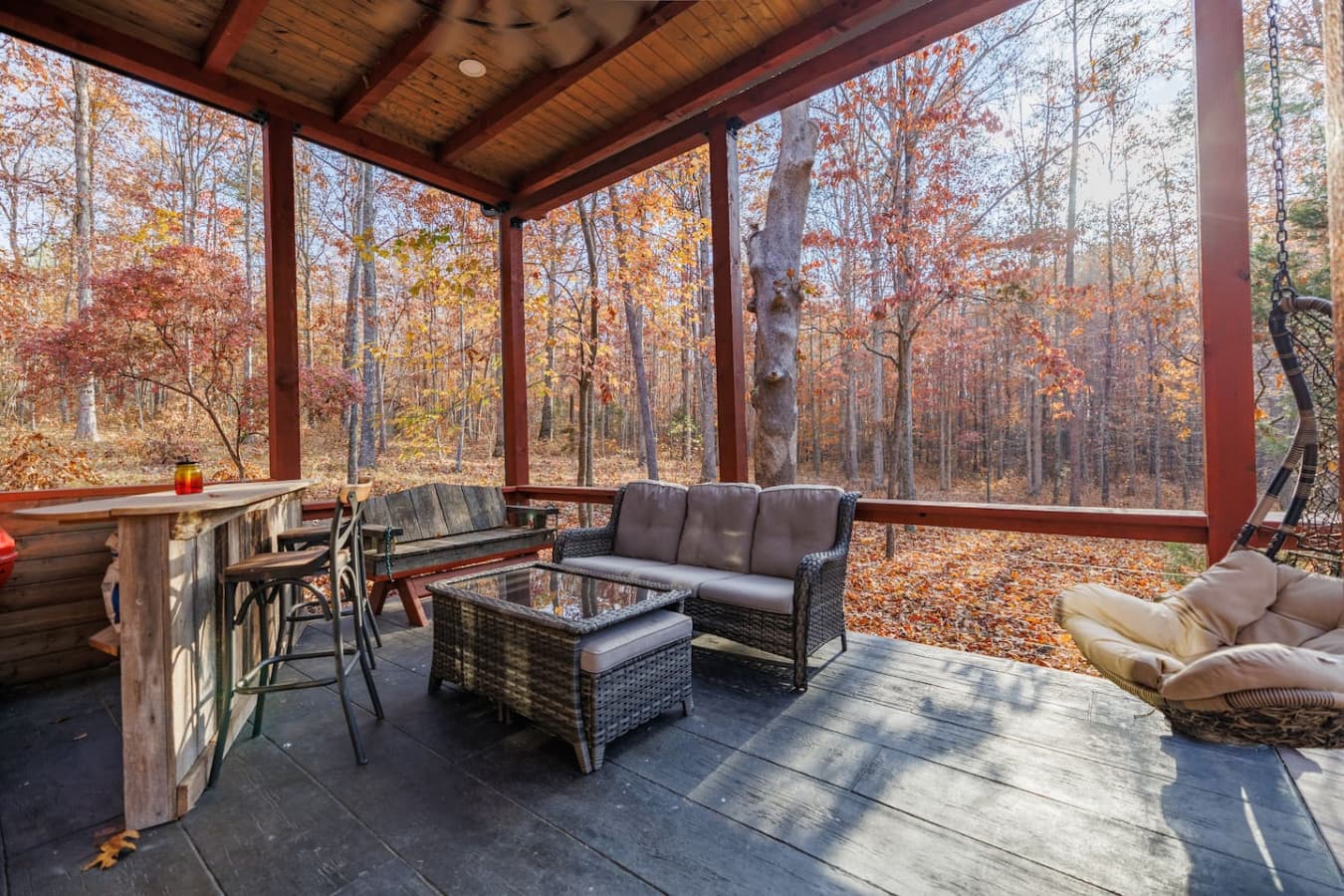 Relax in style with outdoor furniture on the wrap-around porch, perfect for enjoying the fresh air.
