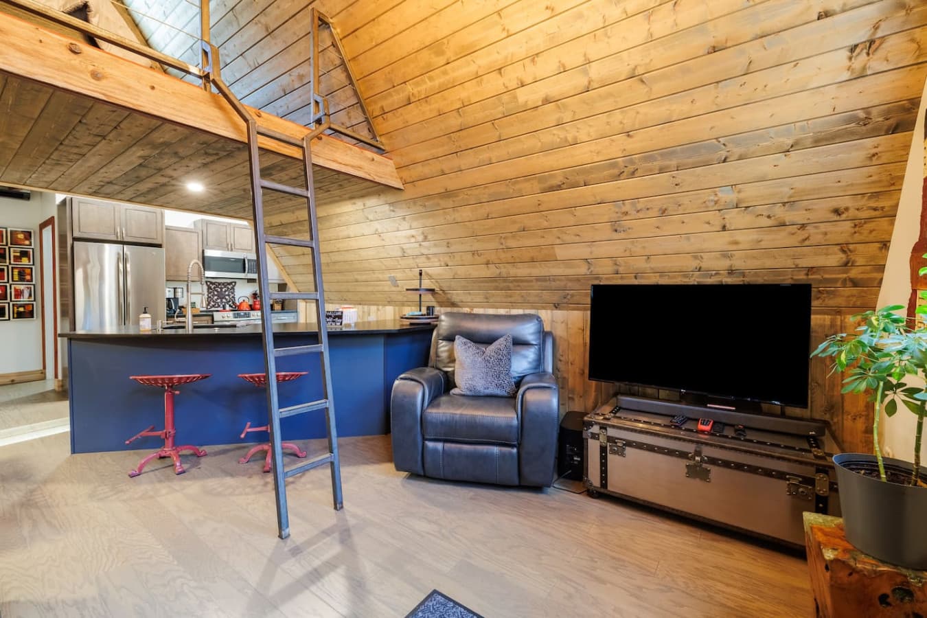 Open concept living (with smart TV), dining and kitchen areas. You can access the loft (Bedroom 2) directly from here.