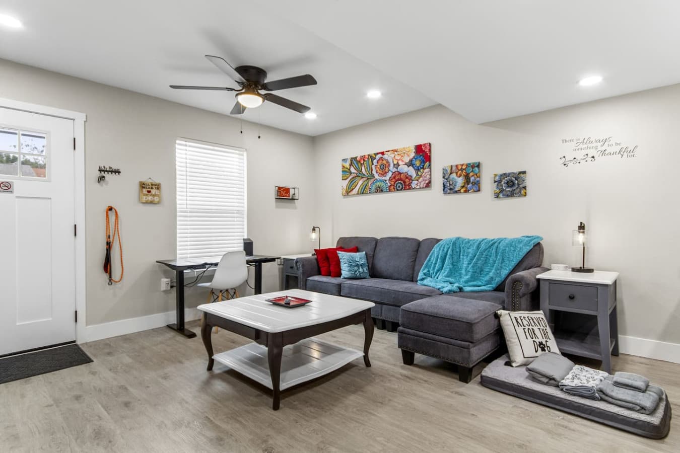Cozy up with loved ones in this bright and inviting living room, perfect for your family or friends to gather.