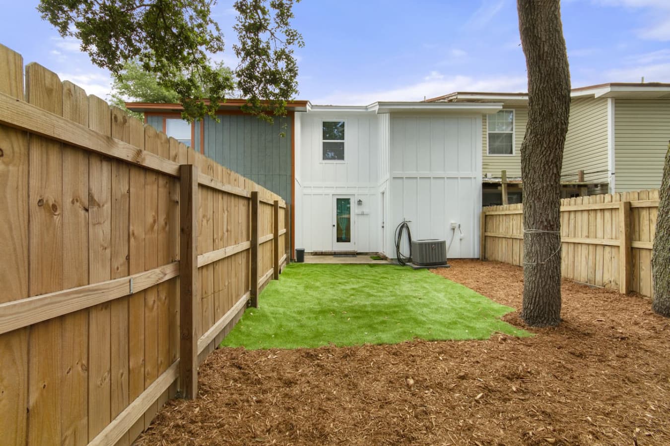 A fully fenced backyard, perfect for morning coffee, outdoor fun, and giving your pup space to roam.