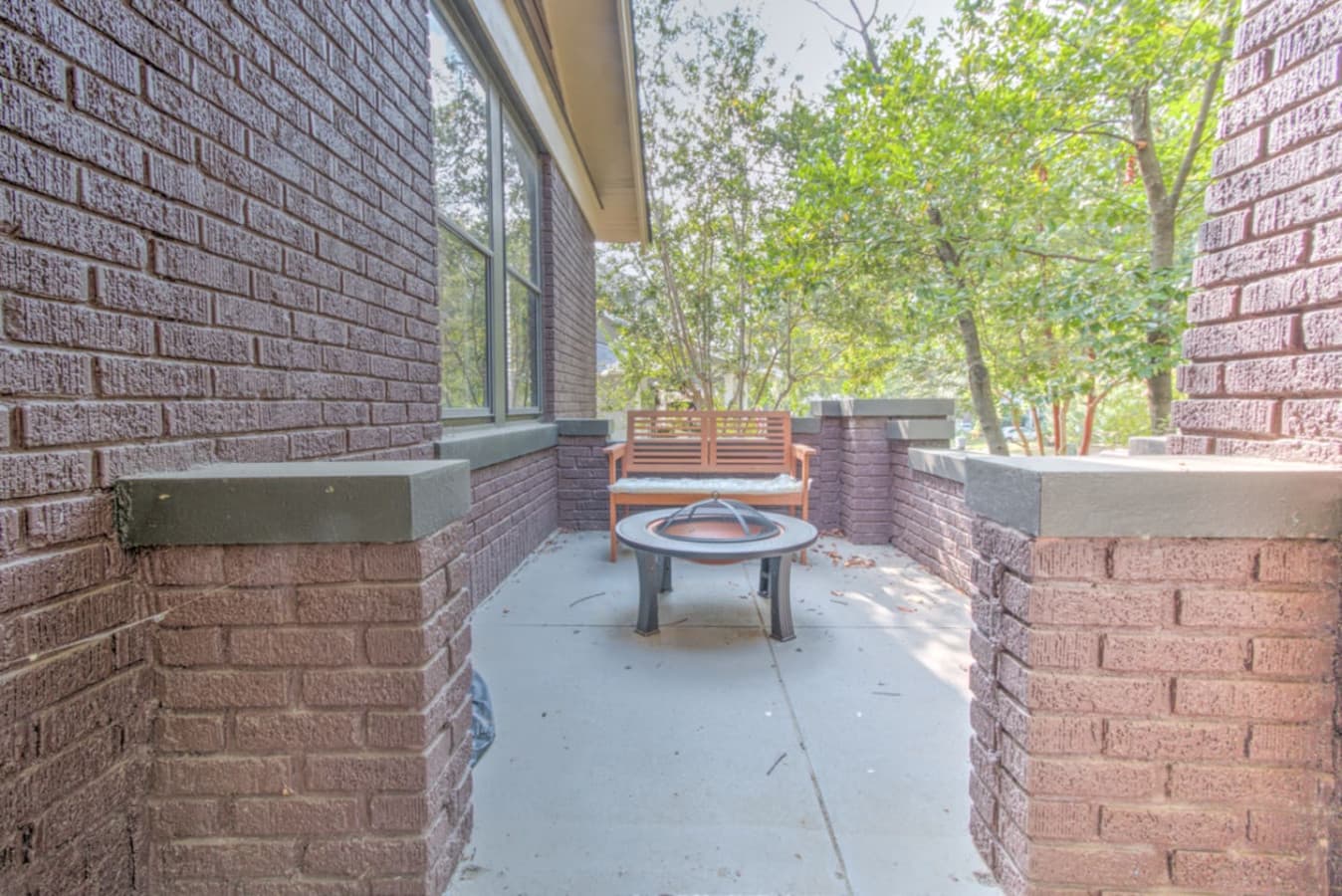 Front patio, you'll find a bench out here too if you want to sit amongst the trees and take in the sounds of the birds chirping.