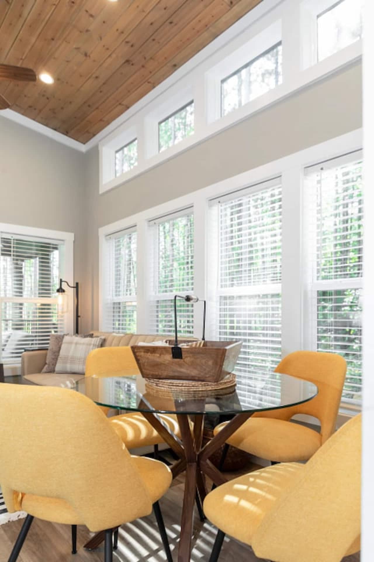 Dining area with seating for four, perfect for meals or remote work with a laptop-friendly setup.
