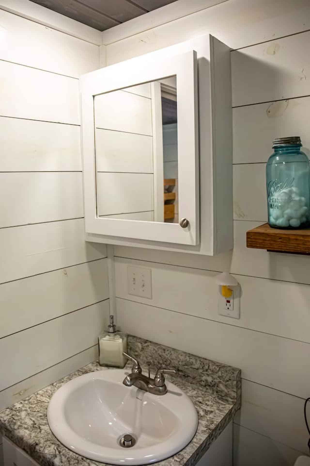 A soothing full bathroom designed for quiet moments of refresh.