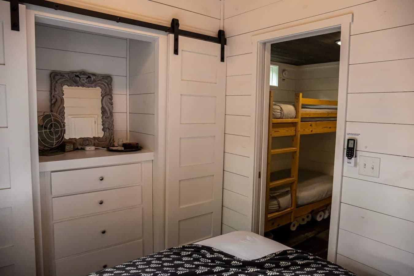 Just outside the main bedroom features the bunk bends.