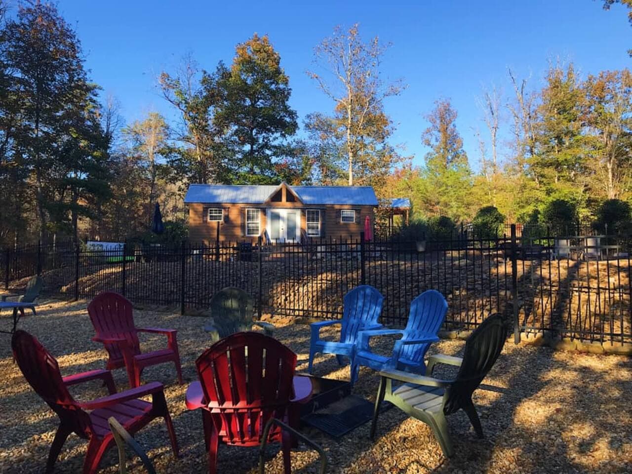Common area with pool house, tiny gym, pool, fire pit, ping pong, hiking trails, hammocks, and swim dock at the river.