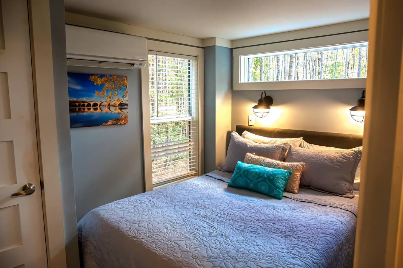 Rest after a day of adventure, with a comfortable bed and thoughtful details.
