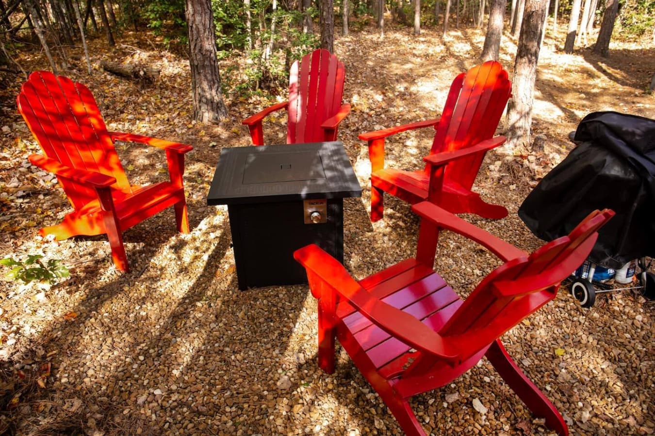 Surrounded by nature, it's the ideal place to relax and enjoy the outdoors, whether you're having a conversation or simply unwinding under the trees.