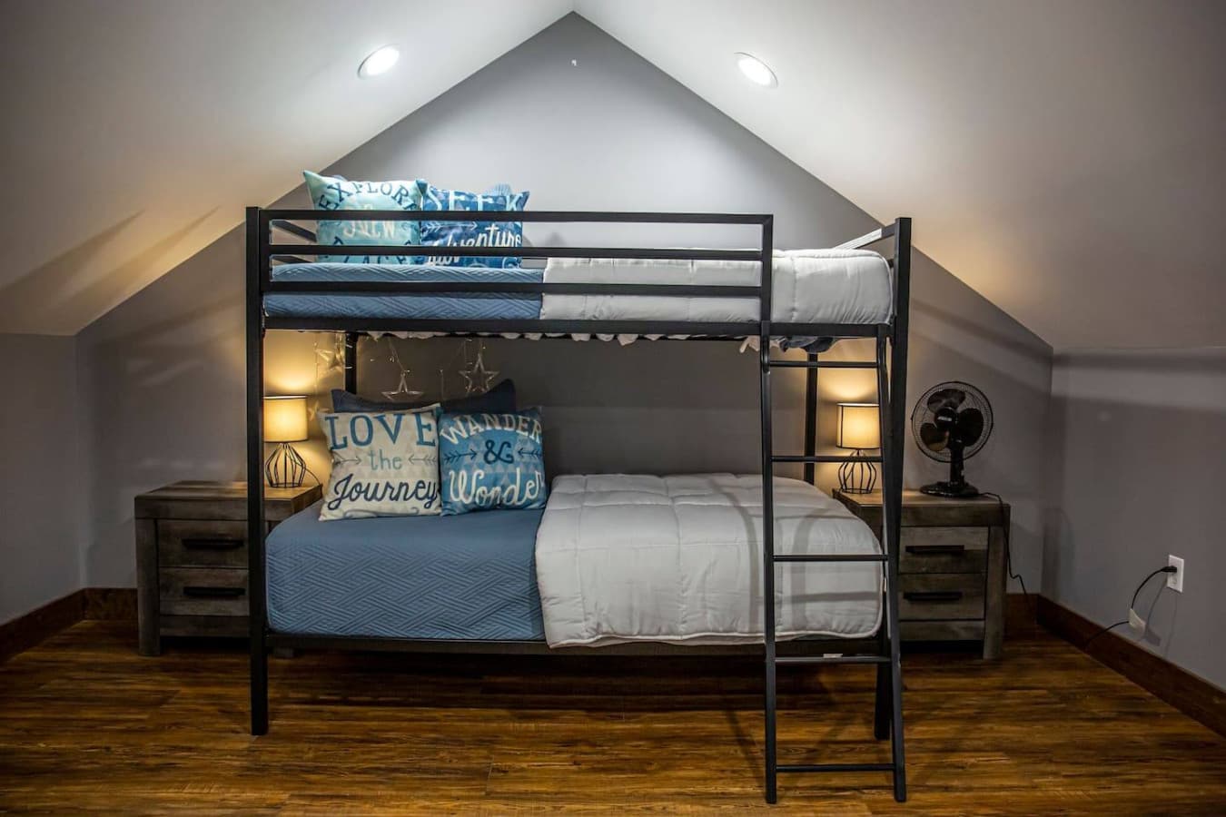 Bedroom 3 (Loft) with twin-over-full bunk bed, cozy lighting, and nightstands on each side — perfect for kids or extra guests.