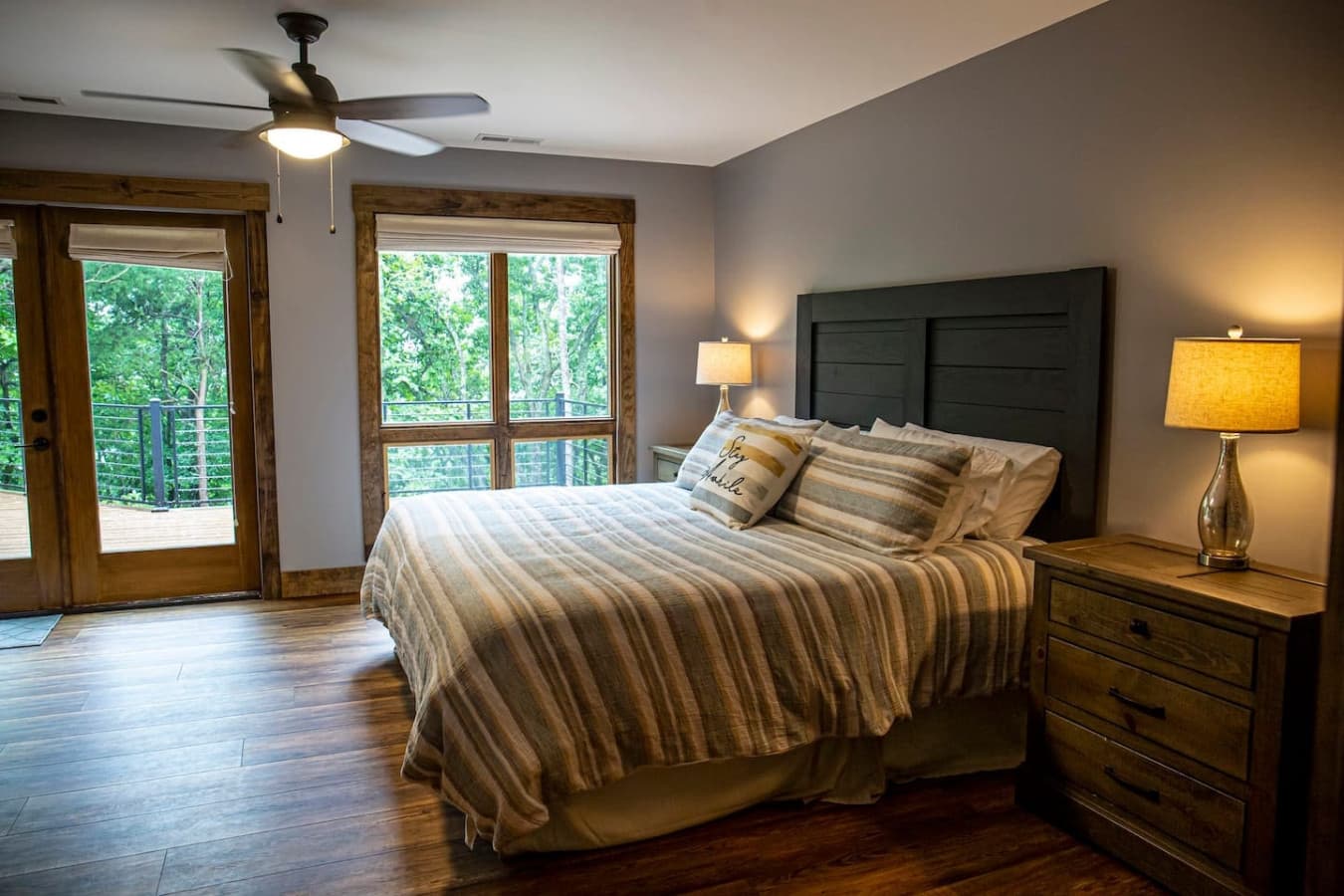 Bedroom 1 (Master) with stunning forest views, king bed, Smart TV, and ensuite bathroom for added comfort.