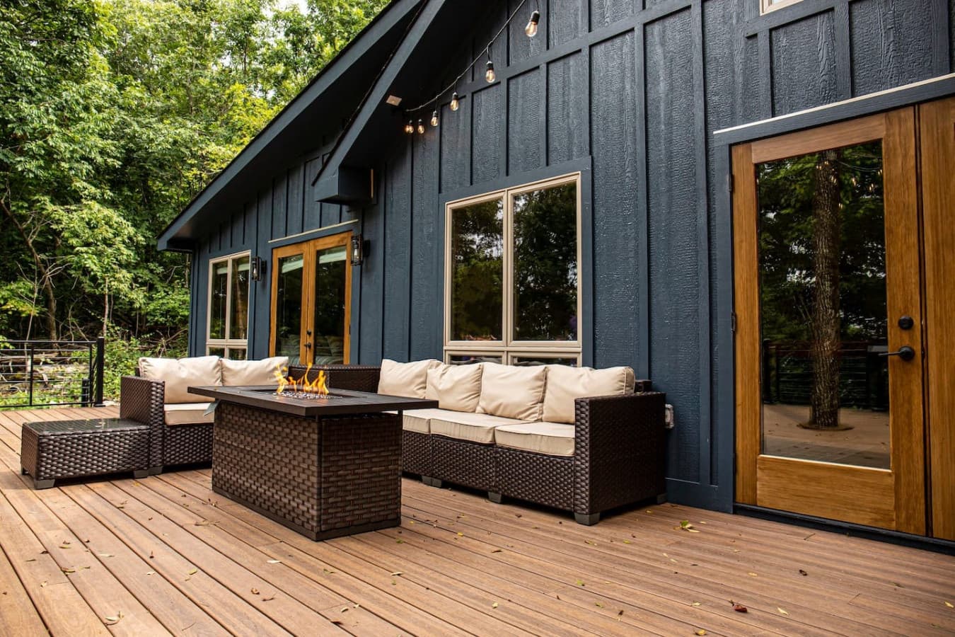 Large back deck with cozy seating, a propane fire pit, and beautiful sunset views—perfect for unwinding outdoors.