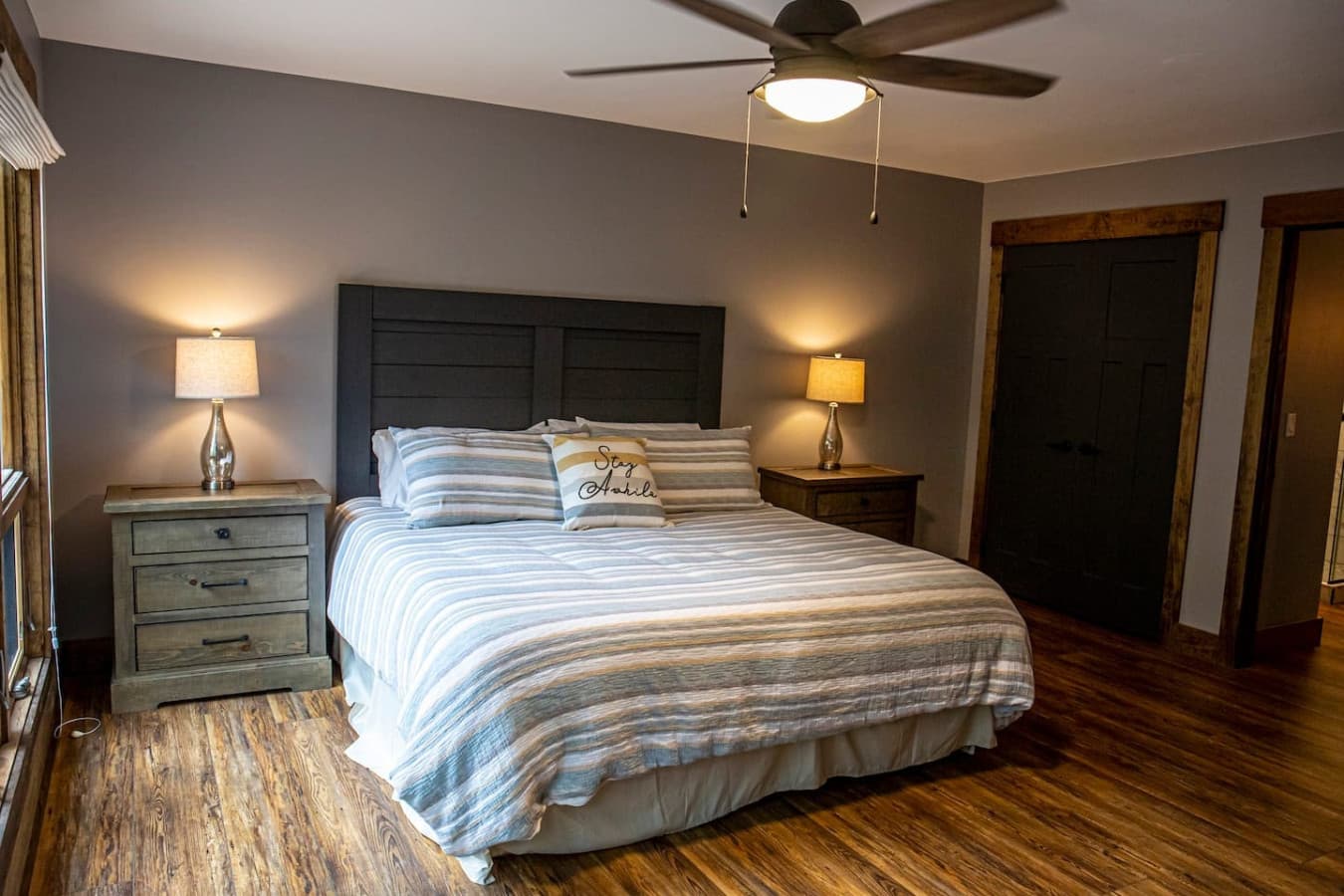 Bedroom 1 (Master) with stunning forest views, king bed, Smart TV, and ensuite bathroom for added comfort.