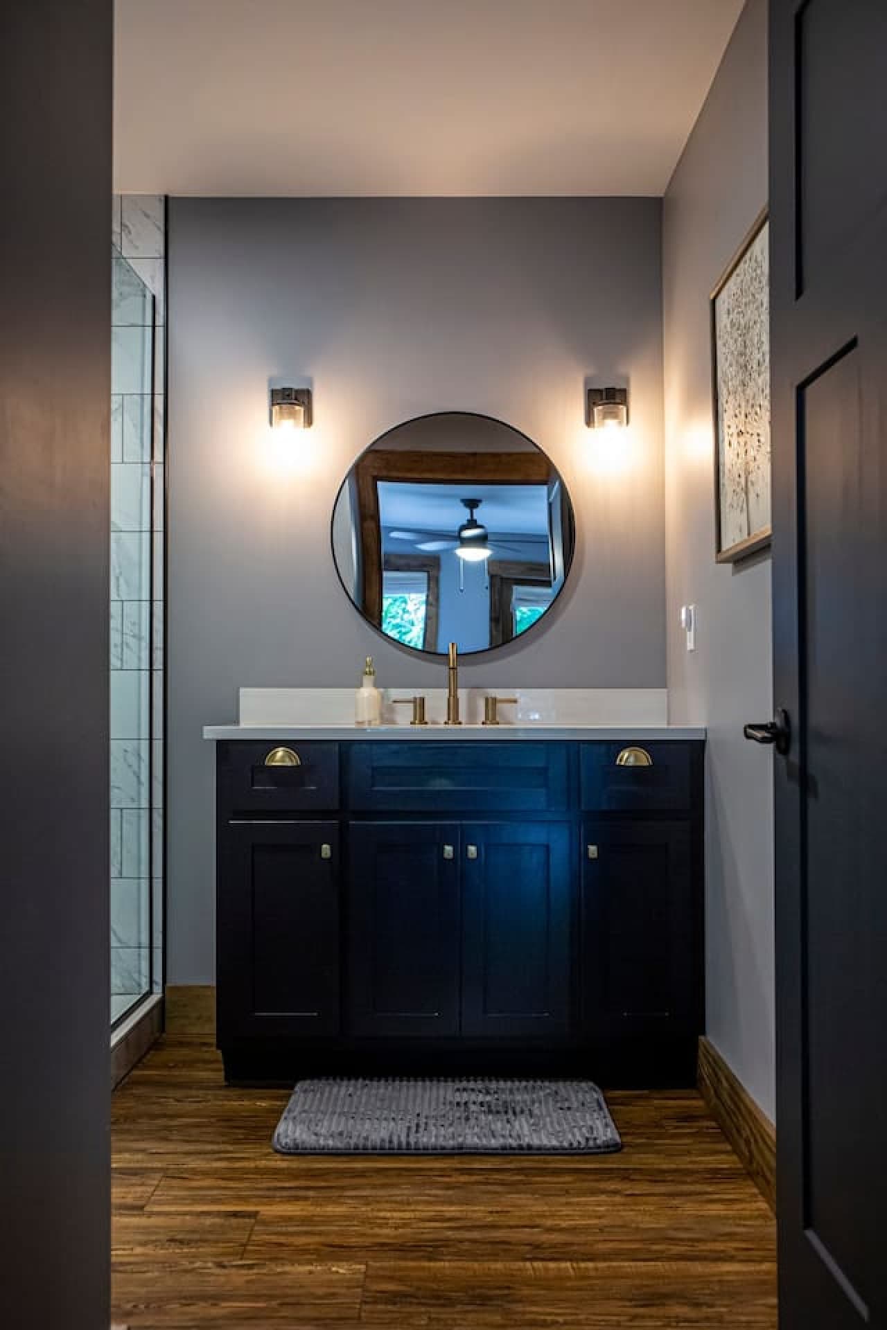 Bathroom 1 (Attached to Master) with modern vanity, gold fixtures, and a glass-enclosed tile shower.