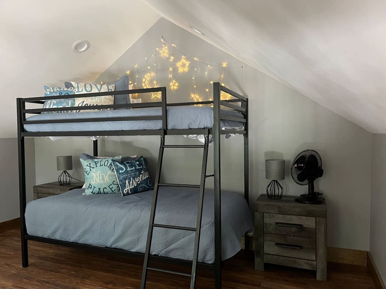 Bedroom 3 (Loft) with twin-over-full bunk bed, cozy lighting, and nightstands on each side — perfect for kids or extra guests.