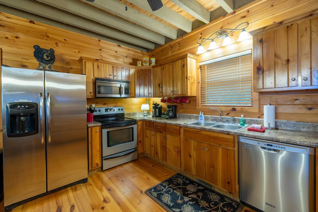 Stocked kitchen with stainless steel appliances.