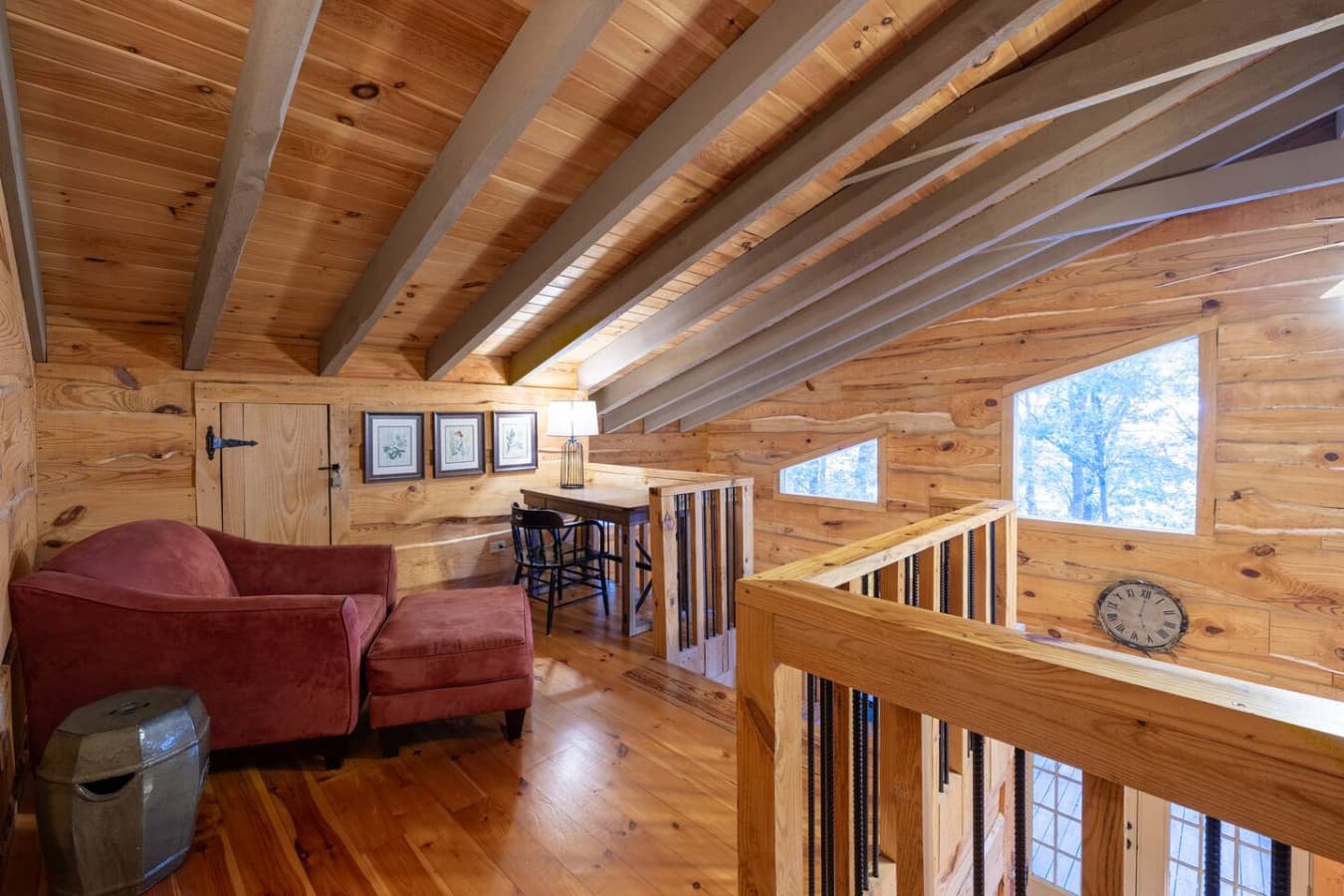 Loft workspace and sitting area at the top of the stairway.