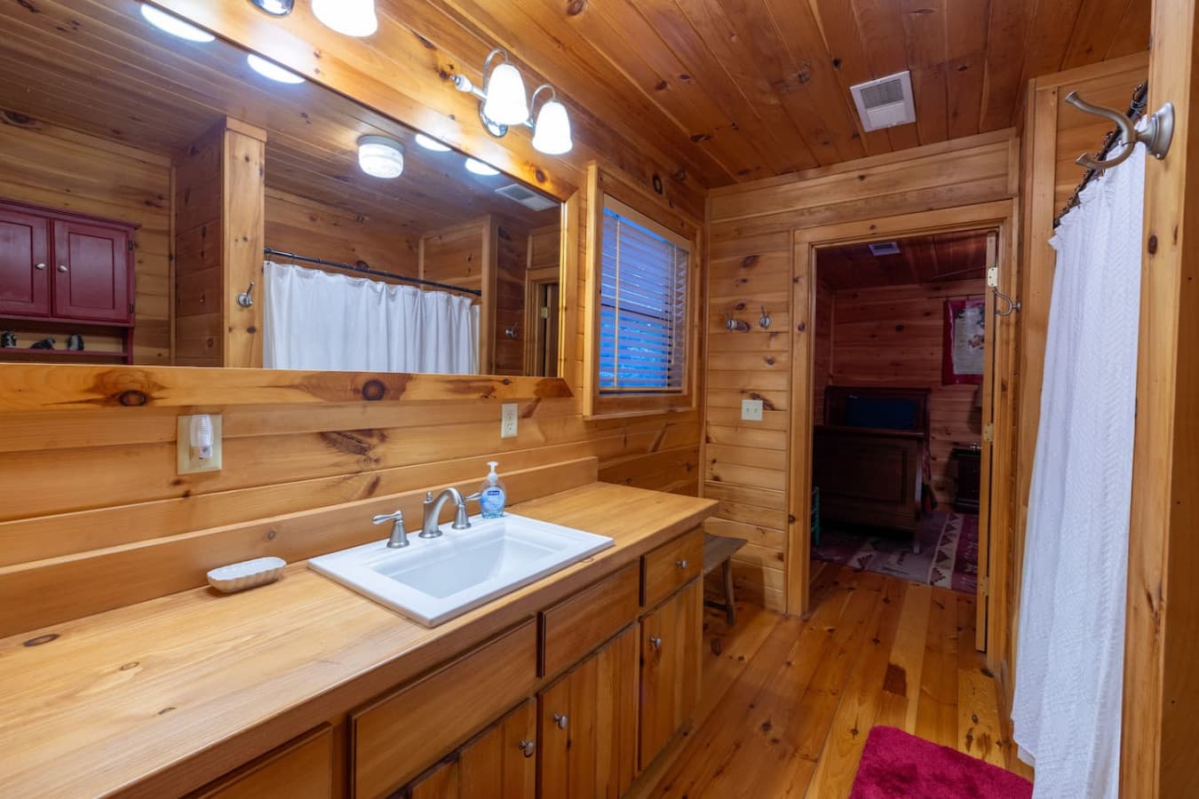 Jack and Jill Bathroom upstairs between the queen bedroom and the 2 single beds bedroom. 
- Tub/Shower Combo
- Toilet
- Large Vanity