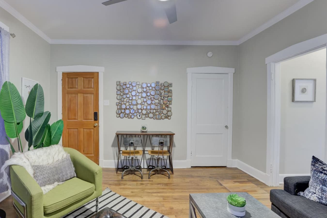 Relax and dine—comfortable living space with a cozy dining spot for two.