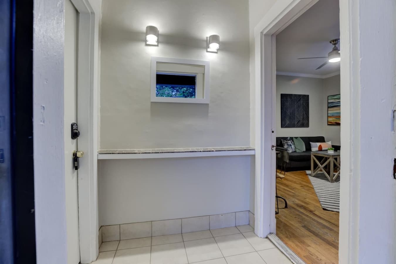 Navigate the shared lobby to the right and step into your cozy space.