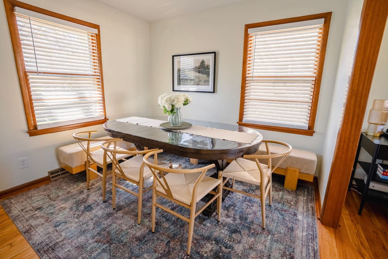 Dining area with bench seating + extra chairs = room for the whole crew, no awkward splits.