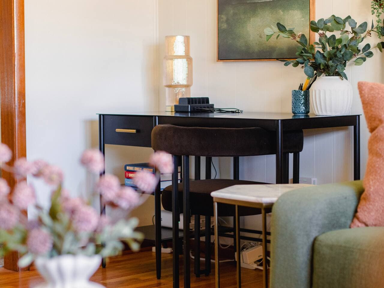 A dedicated workspace is set up in the shared living area for convenience.