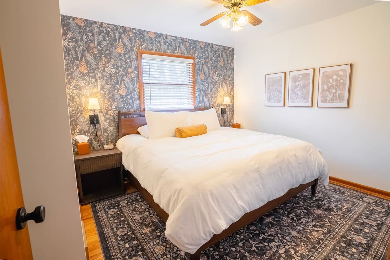 Bedroom with a King bed and window coverings to provide privacy while letting in natural light.