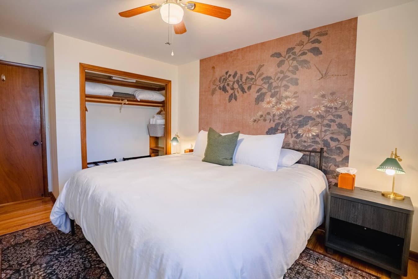 Comfortable king bed with ceiling fan for added airflow.