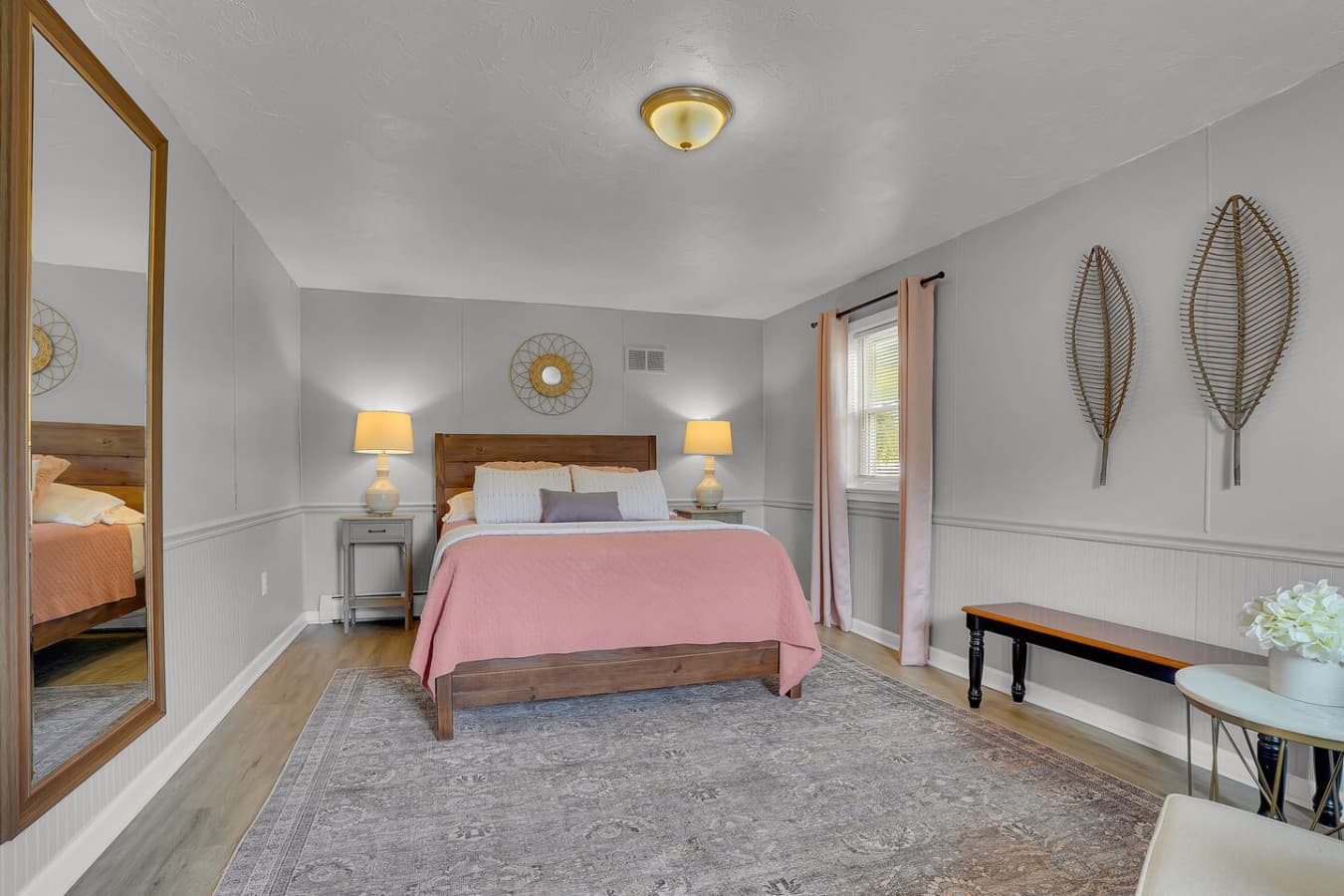 A well-appointed bedroom featuring a plush bed and calming decor, designed for restful nights and relaxing mornings.