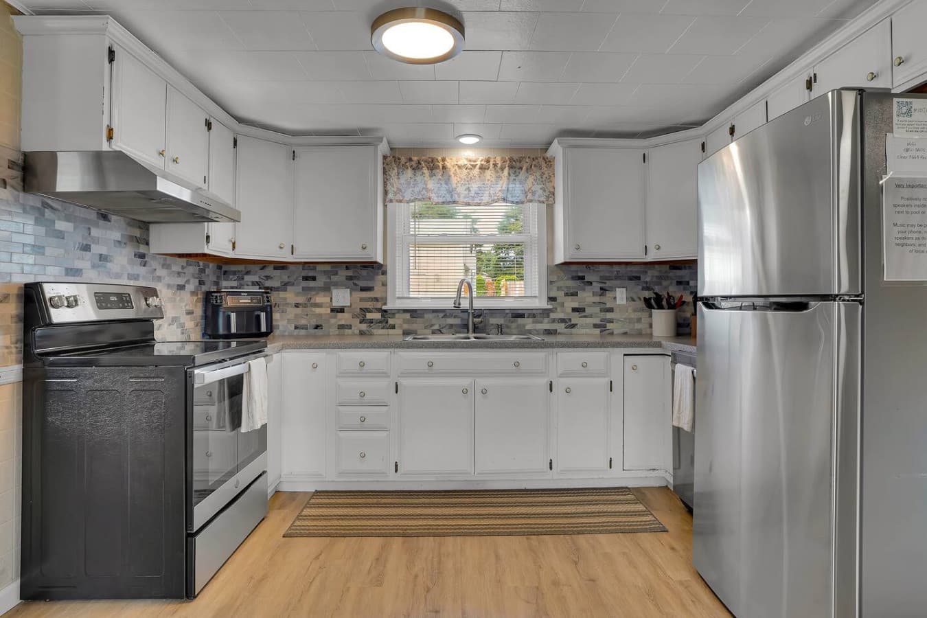 A spacious kitchen with plenty of counter space and all the essentials for preparing meals, offering both style and functionality.