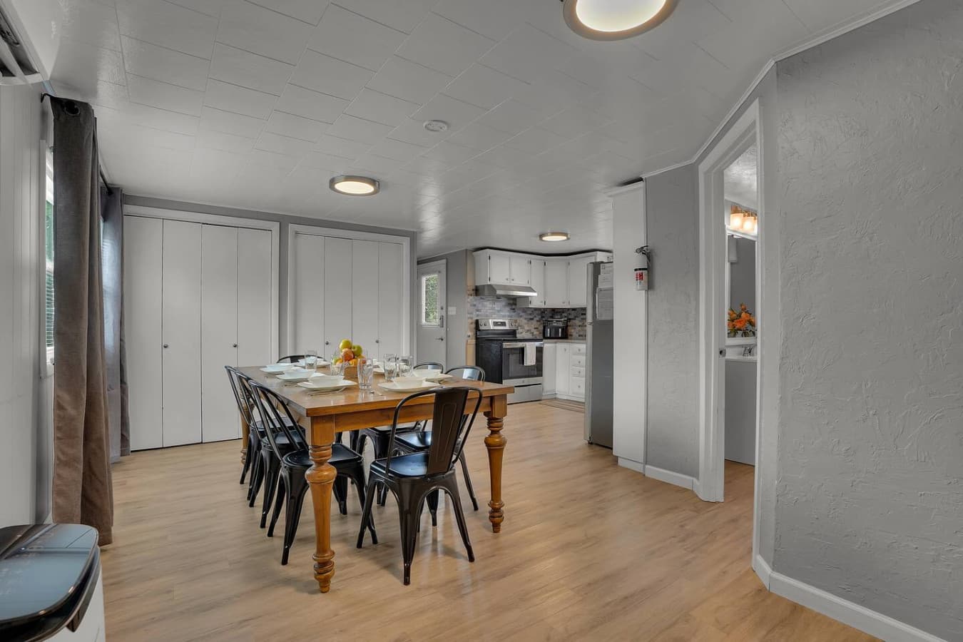 A charming dining area perfect for enjoying meals, featuring a simple yet stylish setup that creates a warm, inviting atmosphere.