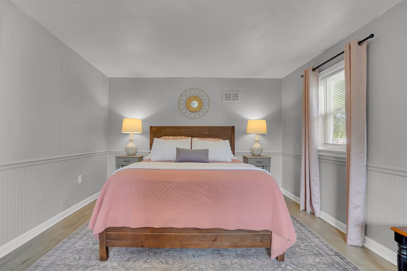A peaceful bedroom with comfortable bedding, soft lighting, and a serene atmosphere, perfect for unwinding after a long day.