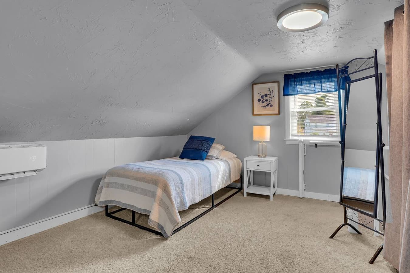 A bright and airy room with three single beds, perfect for friends or family, offering plenty of space and comfort for everyone.