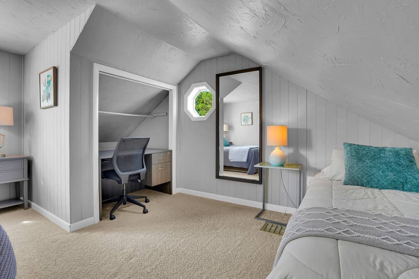 A welcoming room featuring a dedicated workspace.