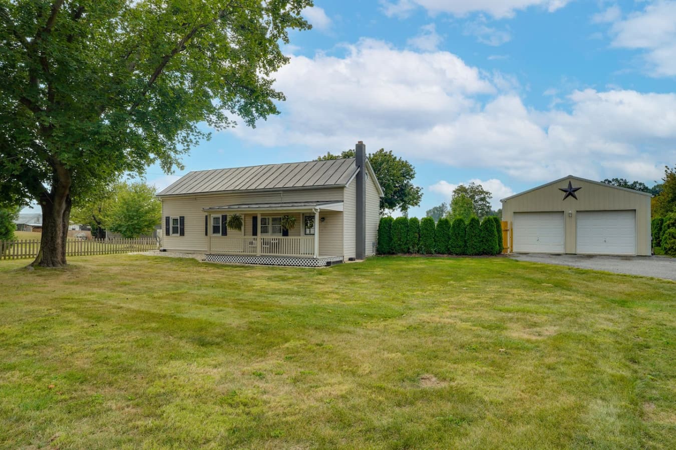 View of the porch and garage from the front yard.