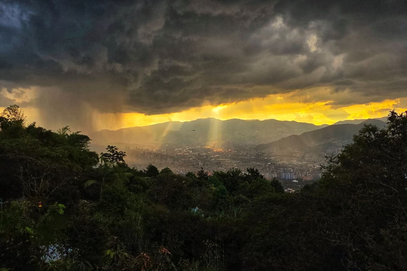 Watch the sky come alive with color as the sun sets over Medellín’s hills and skyline.