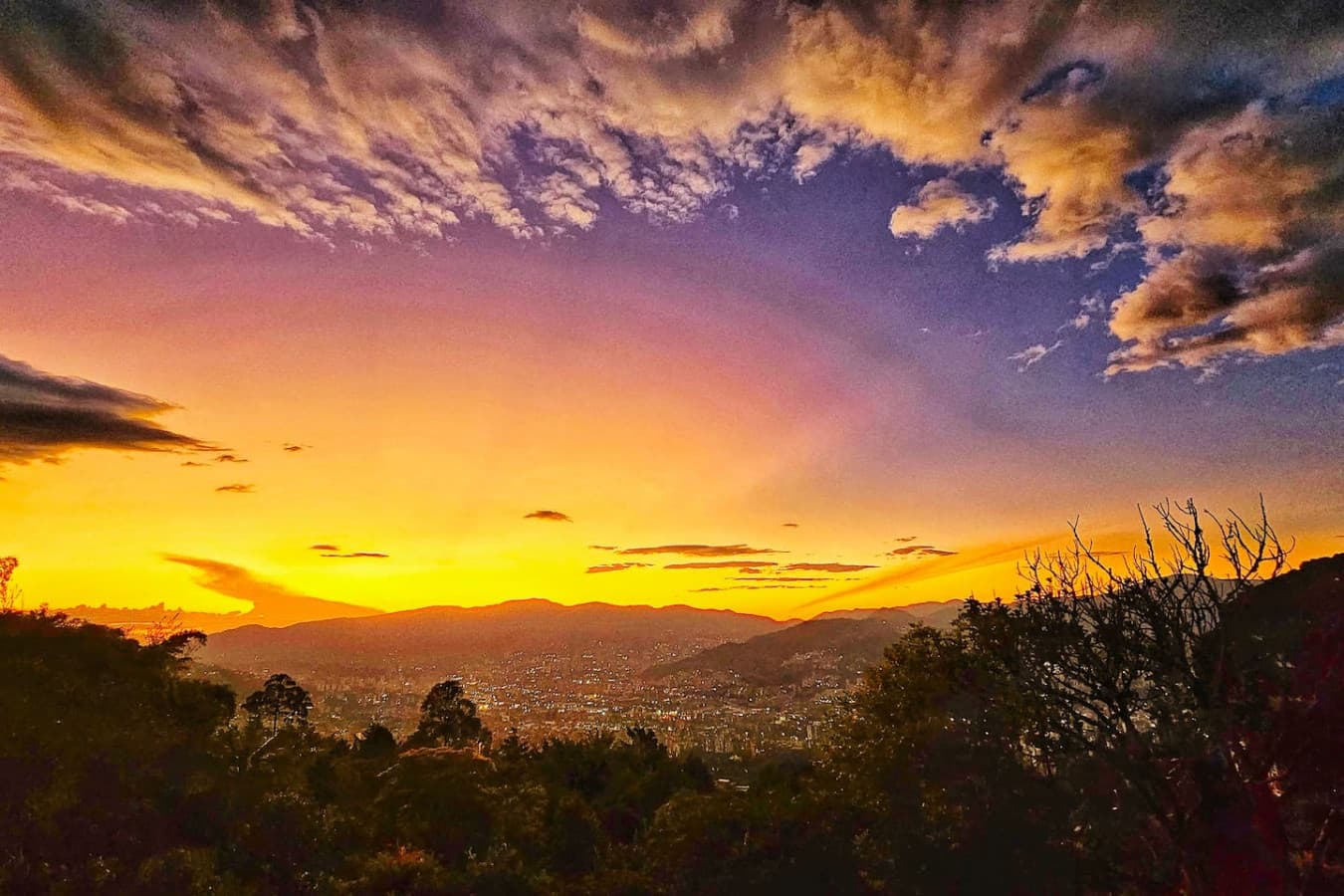 Soak in the magic of sunset as the hills fade into a sea of golden and amber tones.