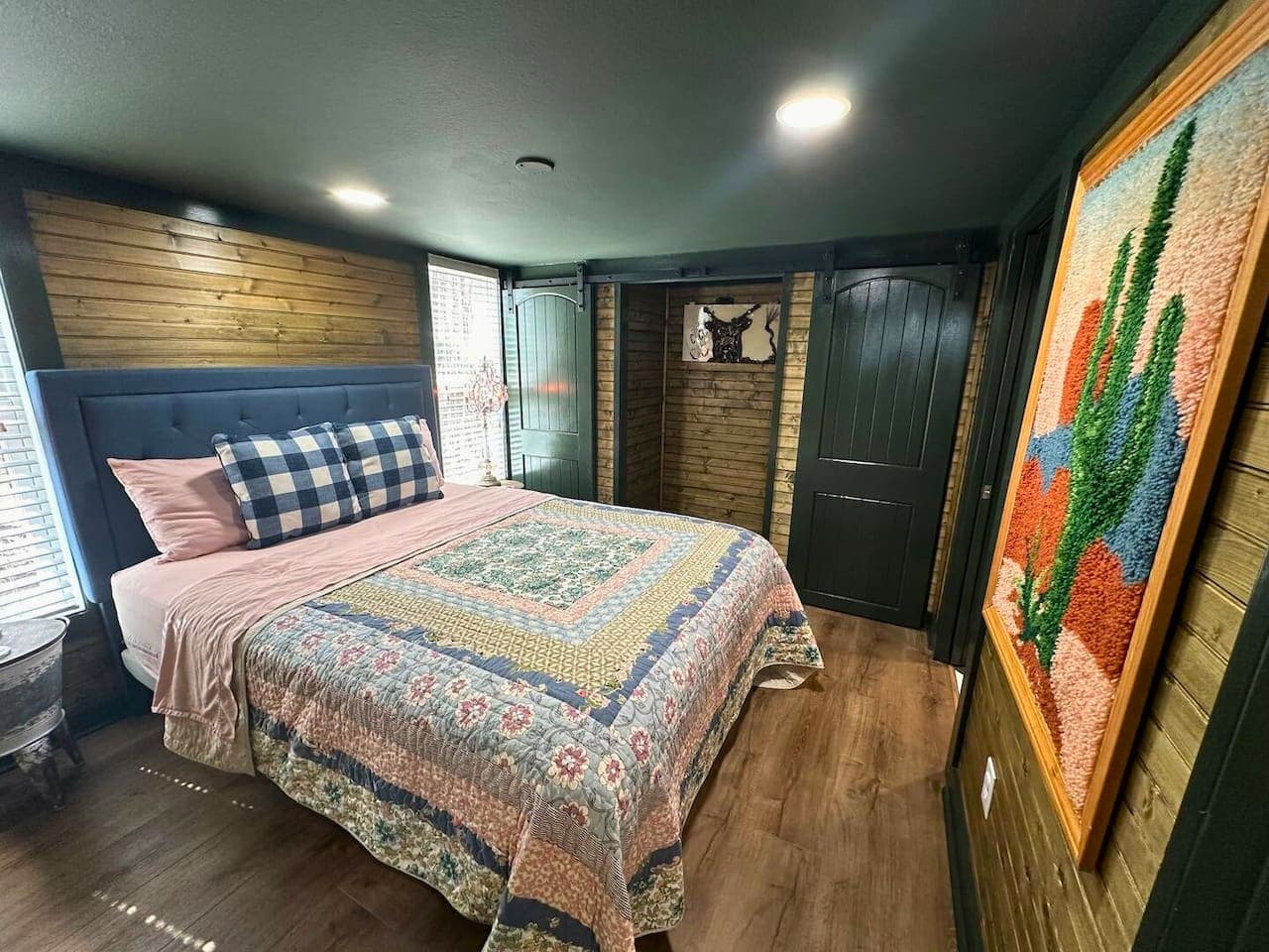 The master bedroom on the main floor features a queen bed, two closets, and two suitcase racks for your convenience.