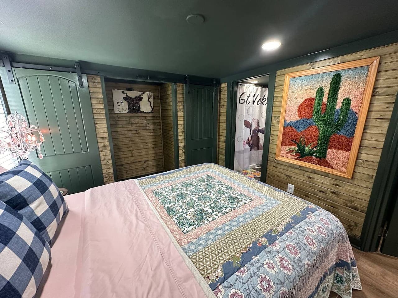 The master bedroom on the main floor features a queen bed, two closets, and two suitcase racks for your convenience.