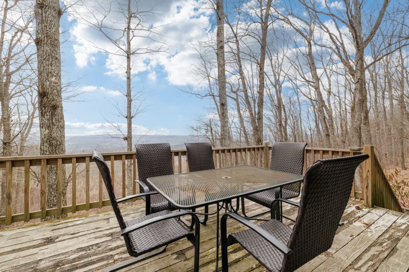 Outdoor dining area with a scenic view steps from the kitchen.