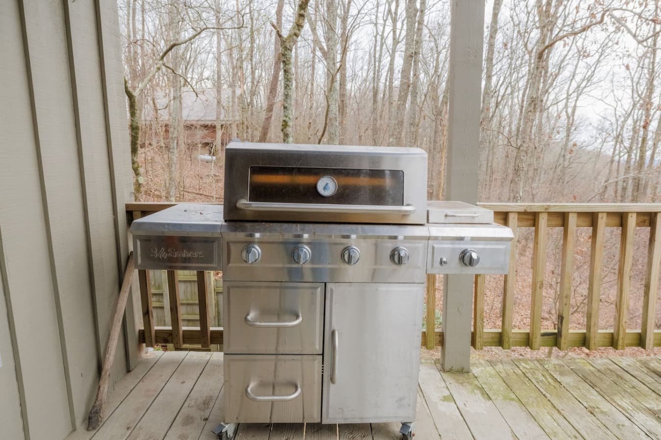 Gas grill located on the back porch off the kitchen.