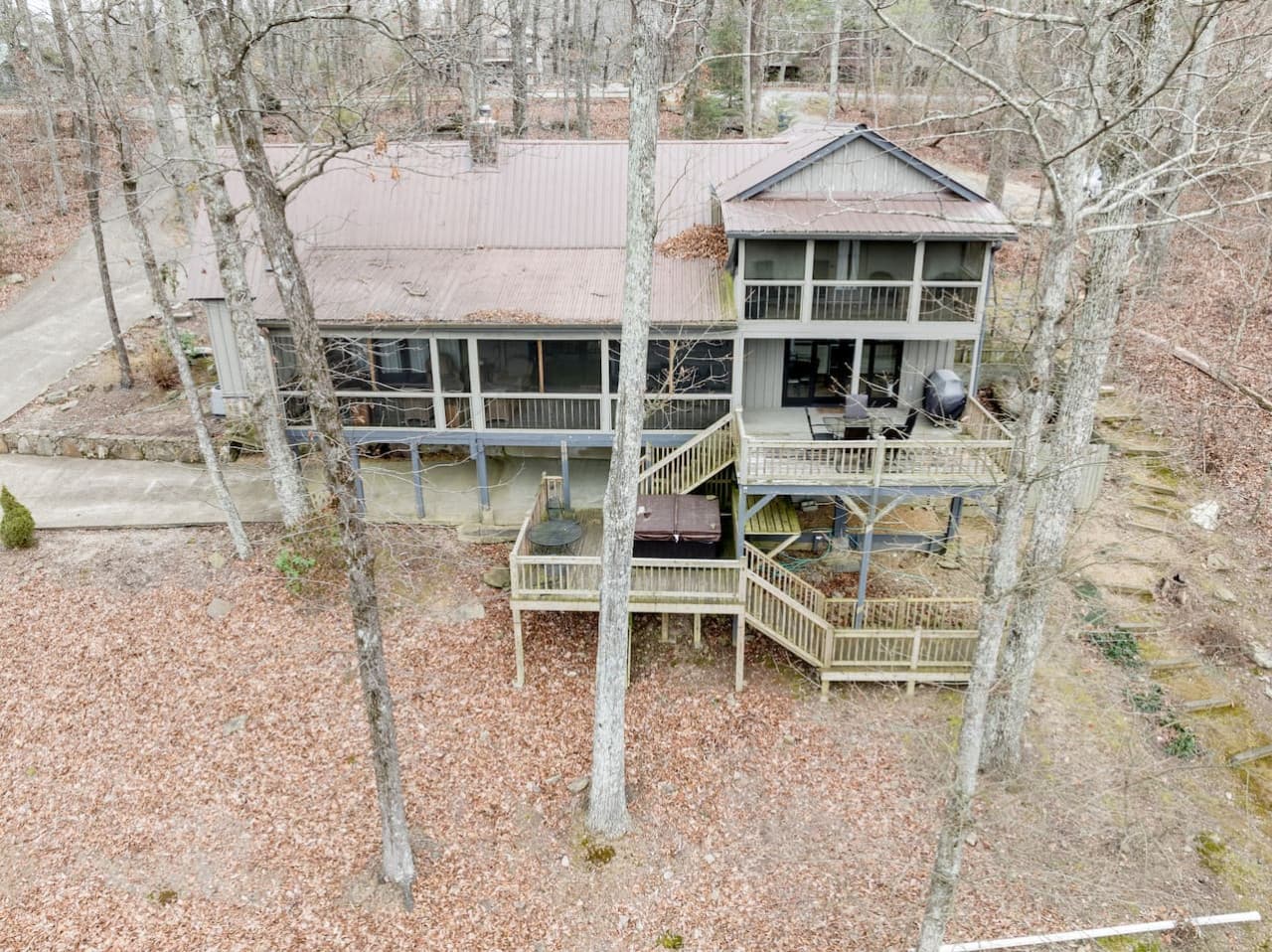 The back of Point of View Cabin showcases three levels of decks with plenty of space to relax and enjoy the view.