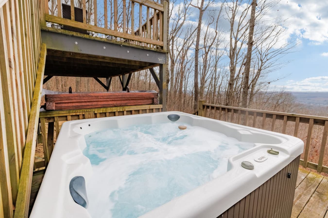 Relax in the hot tub on the uncovered porch of the lower deck — perfect for soaking in the mountain air.
