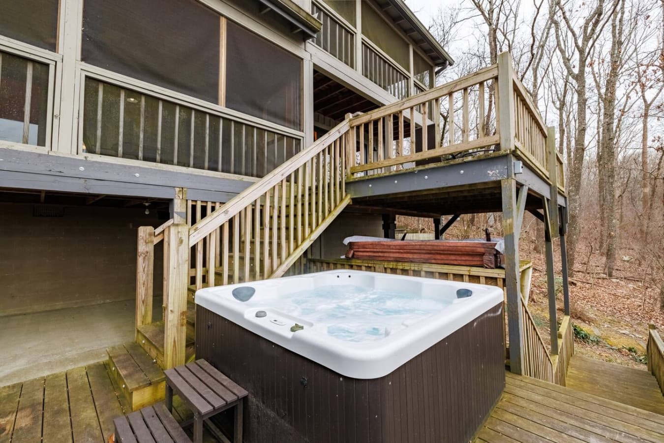 Enjoy a soak in the hot tub on the uncovered porch of the lower deck while taking in peaceful mountain views.