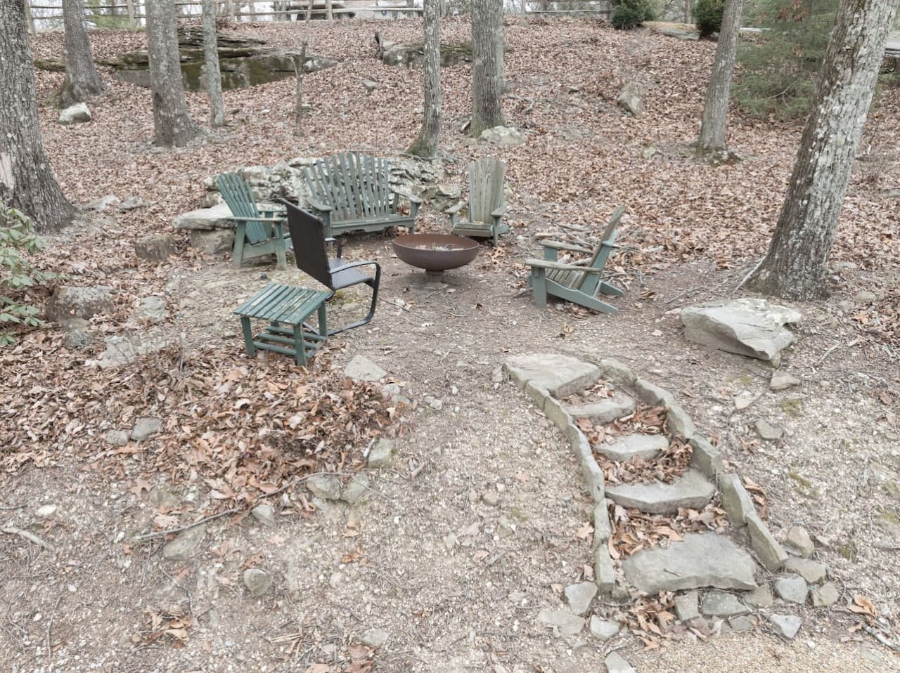 Wood-burning fire pit located at the front of the home.